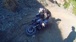 loses his balance and drops his bike.